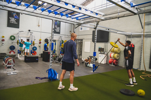 Students taking a strength and conditioning lesson in the PEC.